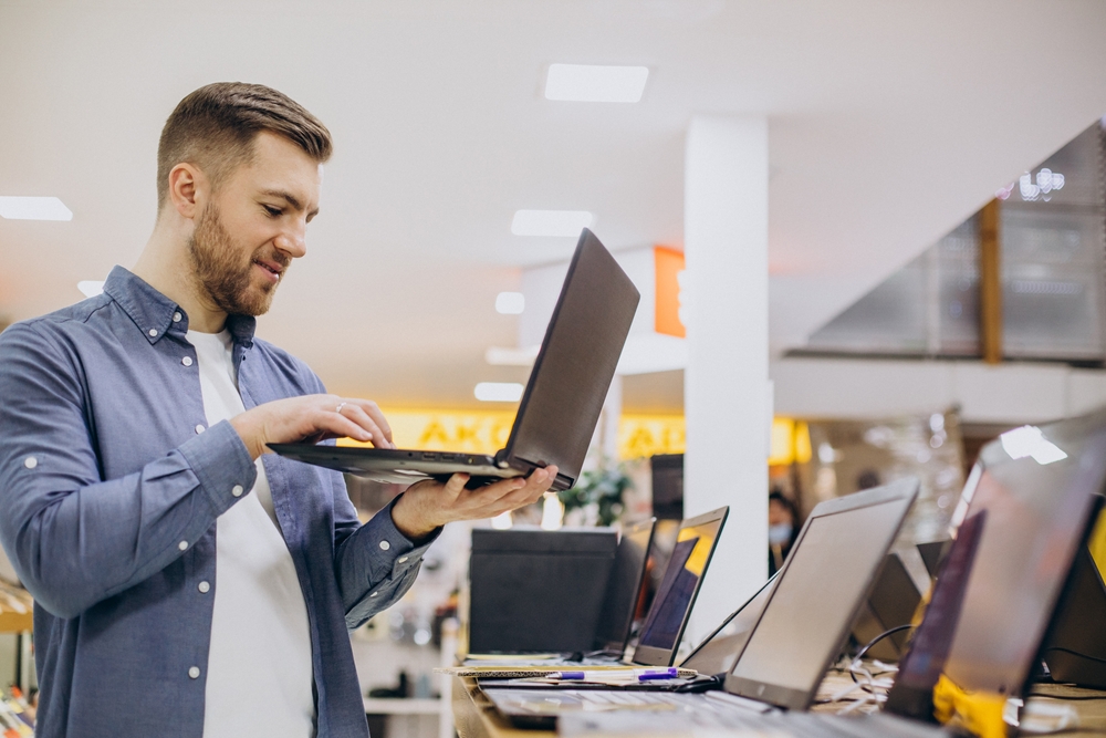 man buying laptop
