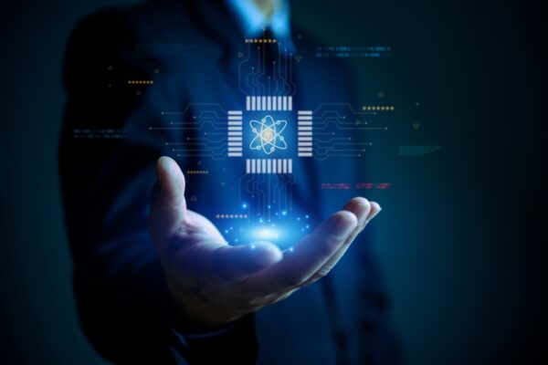 businessman holding digital chip with quantum computing,