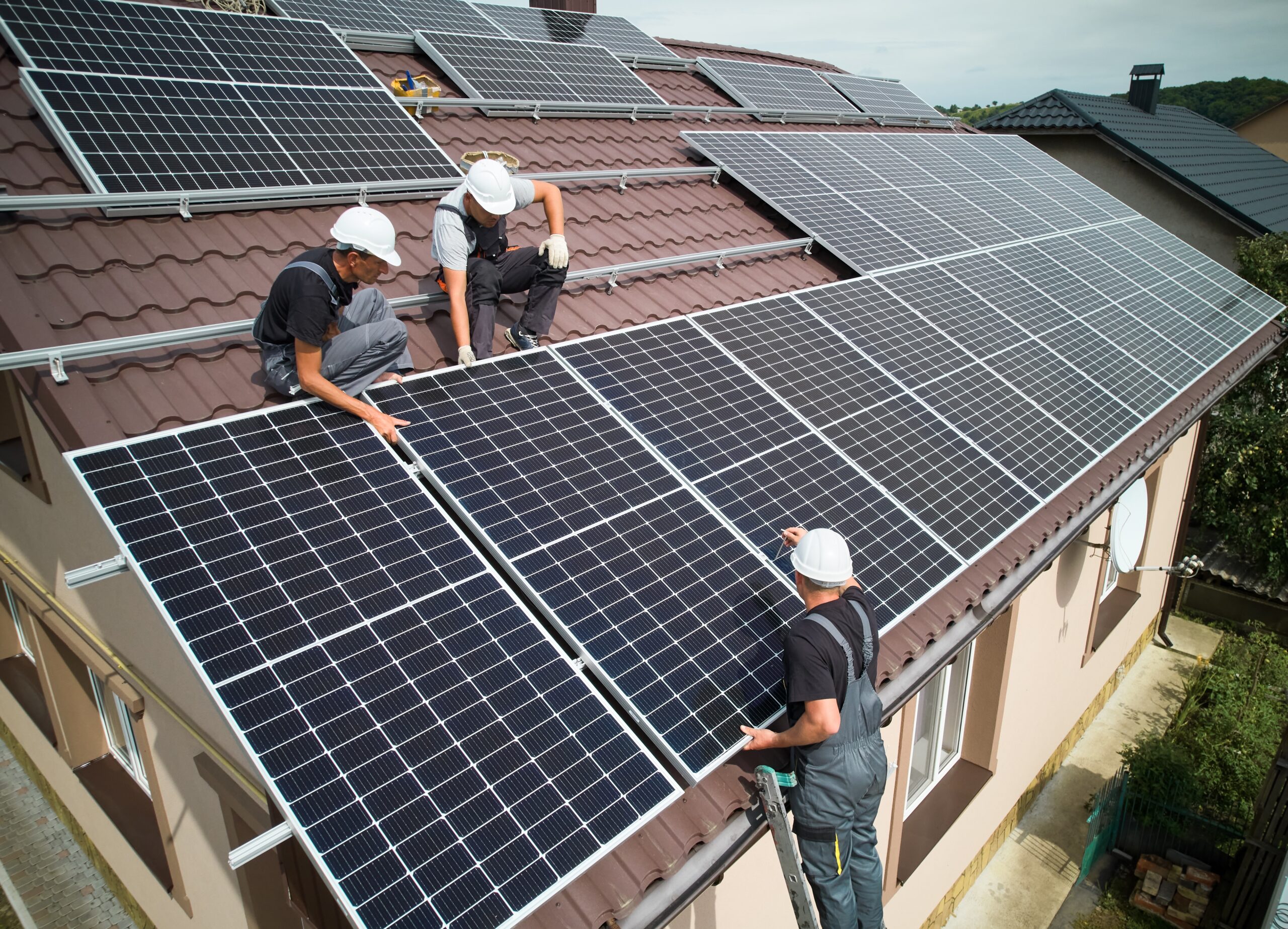 energy efficient home solar panels men installing mounting