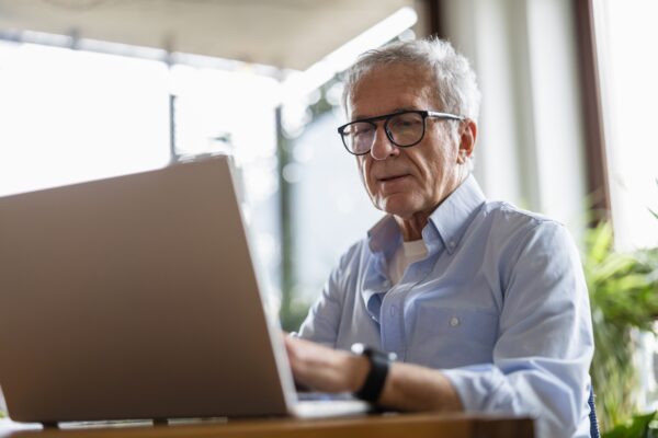 senior man using laptop