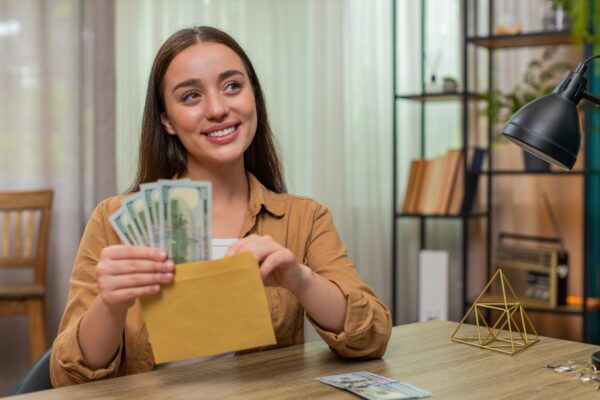 woman saving money dollars income cash